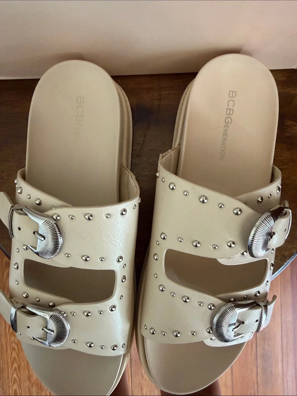 BCBGeneration Ivory Slide Sandals with Silver Buckles